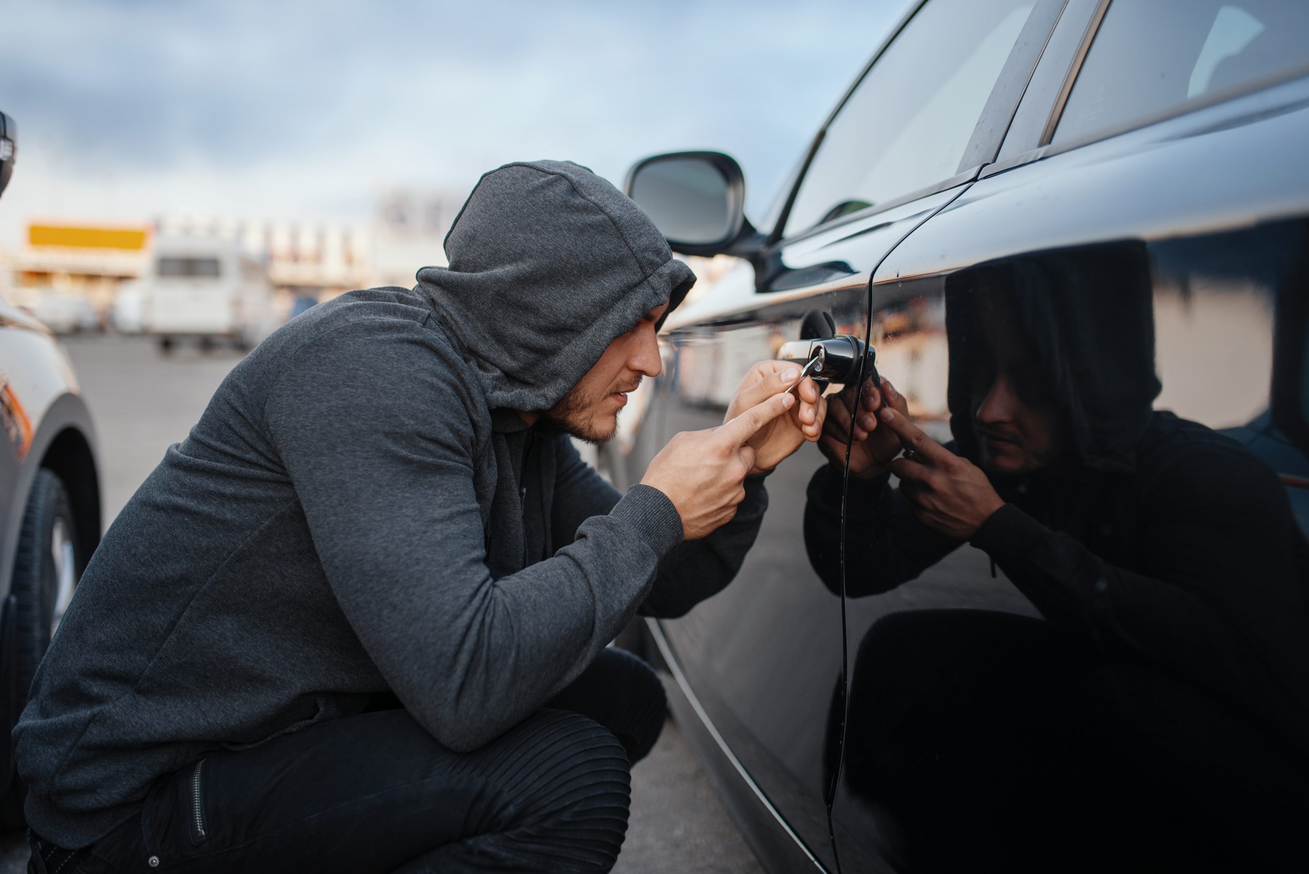 car thief with screwdriver breaking door lock 2021 08 27 09 36 10 utc scaled